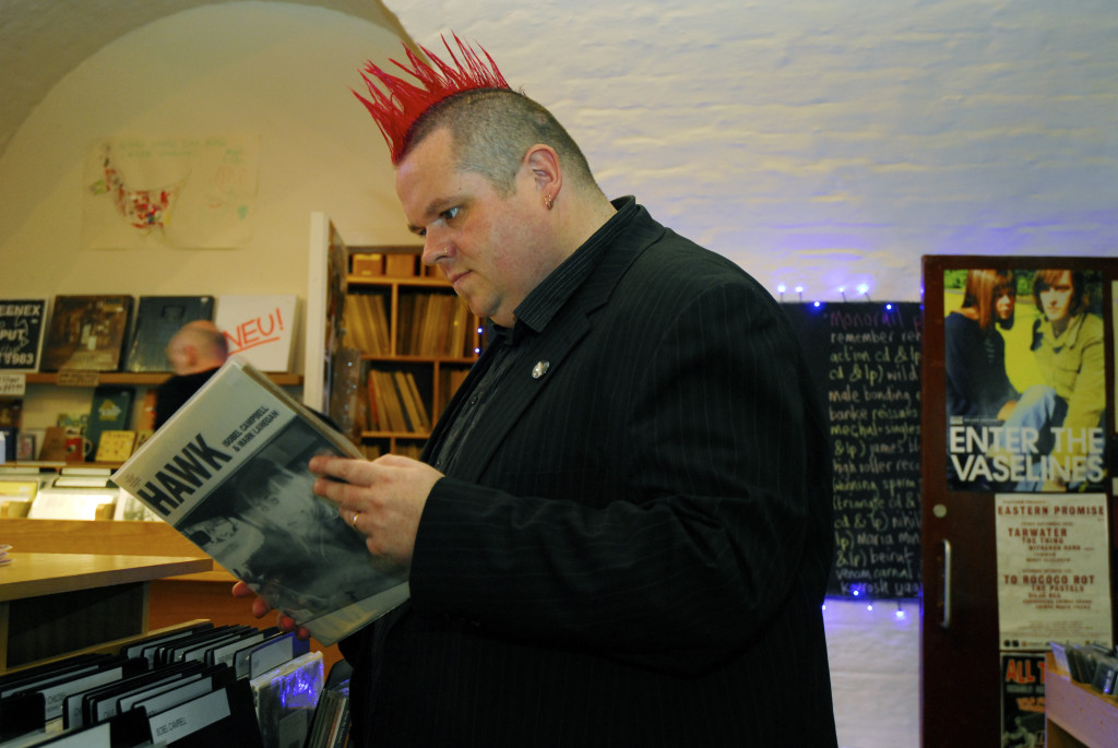 Jim Gellatly browsing through records in Monorail record store