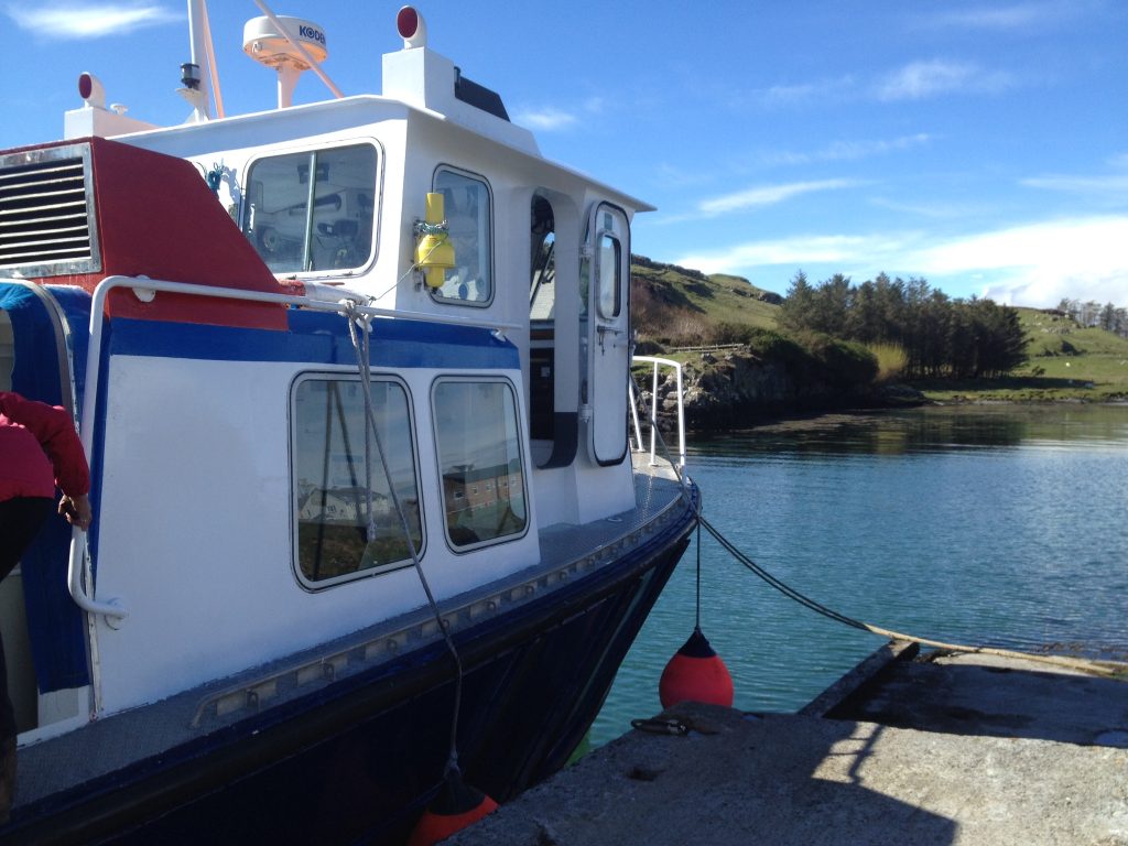 the small ferry boat docked at Isle of Muck harbour