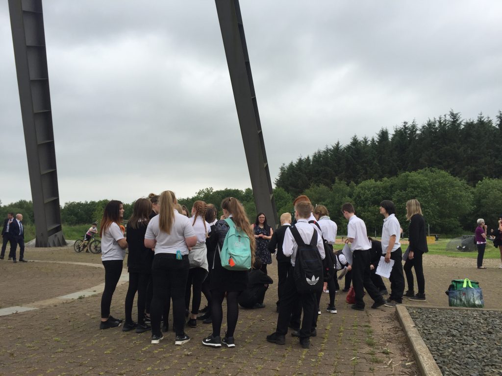 Students in school uniform beneath the A frame