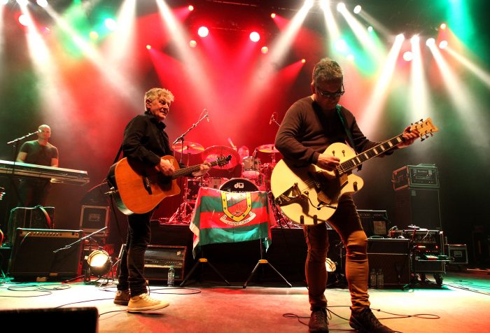 Saw Doctors under the spotlights, showing Kieran on keys, Davy and Leo on guitars 