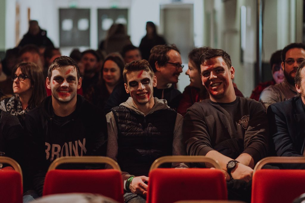 Smiling blood-smeared faces waiting for Dawn of the Dead at Buchanan Galleries, image by Ingrid Mur for Glasgow Film Festival 2018